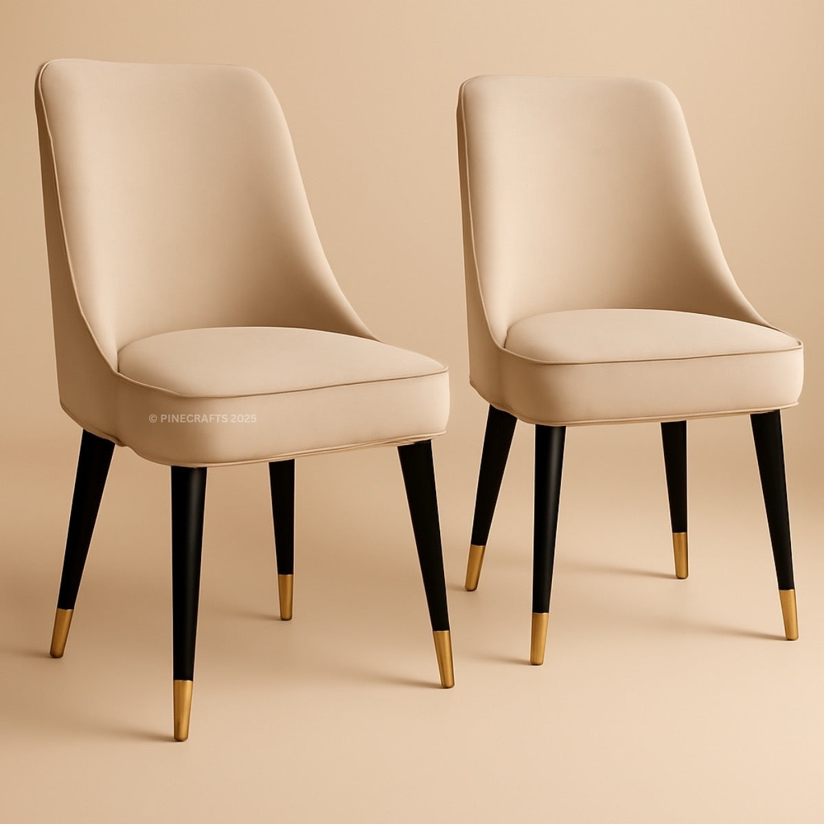 Two beige chairs with black legs and gold toes on a beige background